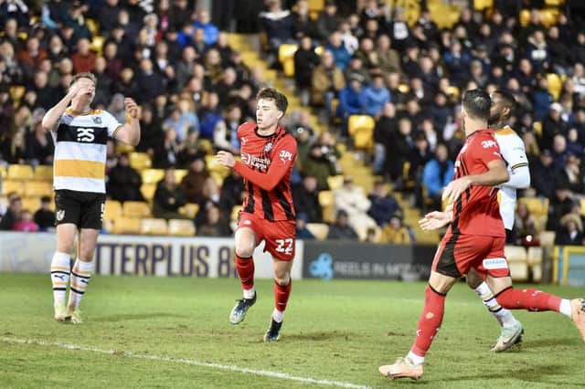 Chris Sze celebrates his goal before the 'mass confrontation' between both sets of players at Port Vale last month