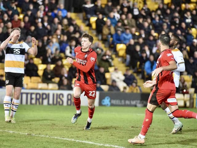 Chris Sze celebrates his goal before the 'mass confrontation' between both sets of players at Port Vale last month