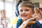 Isaac, five, gets his face painted.
