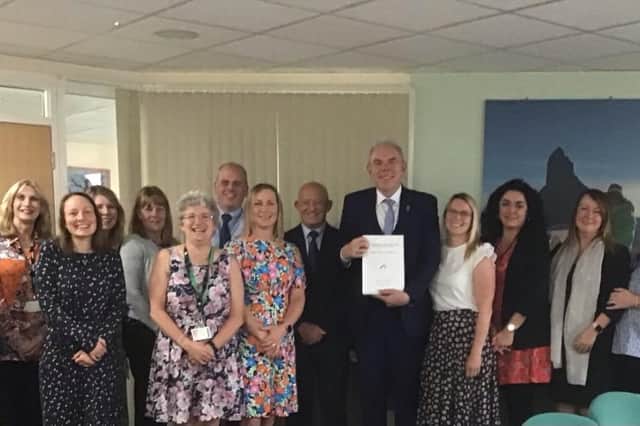 Tim Sherriff Programme Lead and headteacher at Westfield Community School with staff members.