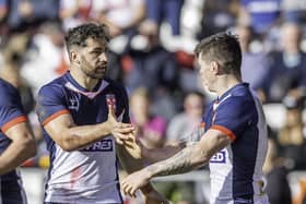 Toby King is congratulated after scoring a try against Tonga.