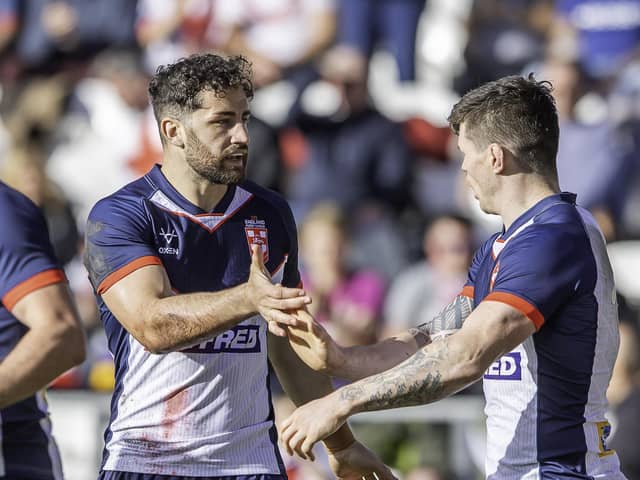 Toby King is congratulated after scoring a try against Tonga.