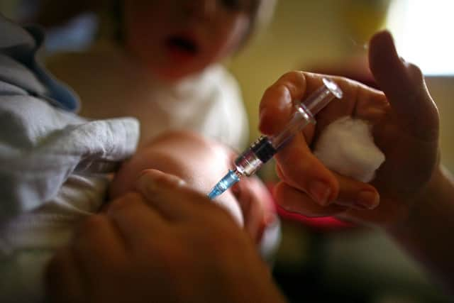 Stock image of child being given immunisation jab (Photo by Jeff J Mitchell/Getty Images)