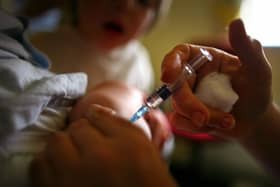 Stock image of child being given immunisation jab (Photo by Jeff J Mitchell/Getty Images)