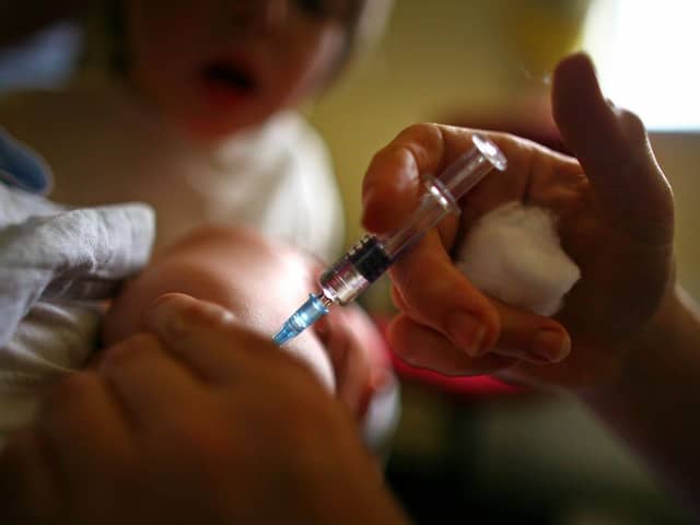 Stock image of child being given immunisation jab (Photo by Jeff J Mitchell/Getty Images)