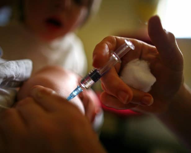 Stock image of child being given immunisation jab (Photo by Jeff J Mitchell/Getty Images)