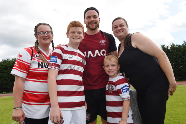 Liam Marshall joins fans for a group picture.
