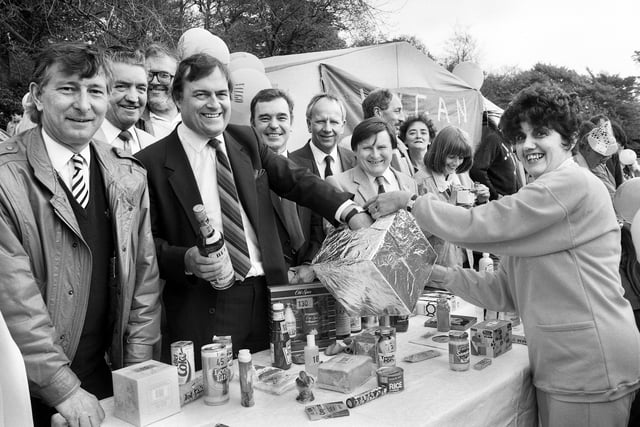 Shadow Employment Spokesman and Future Deputy Prime Minister, John Prescott, trys his luck on the tombola stall with Wigan Labour Party officials at the May Day Carnival at Haigh Hall on Monday 4th of May 1987.
