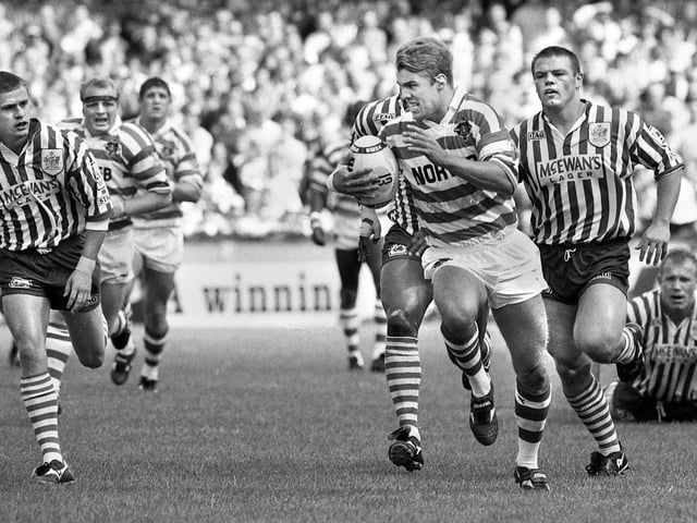 Wigan centre Gary Connolly races away to score one of his two tries against his old club St. Helens in a league match at Knowsley Road on Monday 28th of August 1995.
Wigan won 52-20.