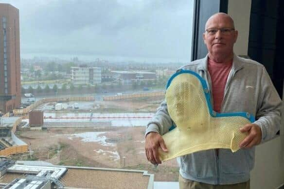 Stuart Keane with the mask he wore while receiving radiotherapy treatment as he battled cancer