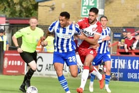 Josh Magennis admits he enjoys international football - but also wishes he was back home to help Latics regroup