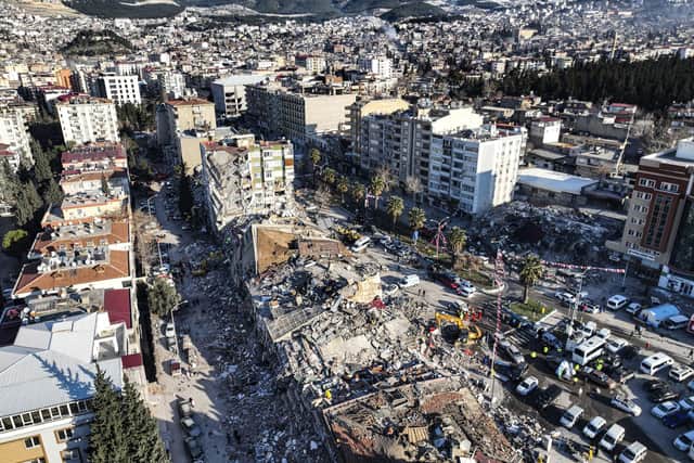 An aerial photo shows the destruction in Kahramanmaras, southern Turkey. Thinly stretched rescue teams worked through the night in Turkey and Syria, pulling more bodies from the rubble of thousands of buildings toppled by a catastrophic earthquake.