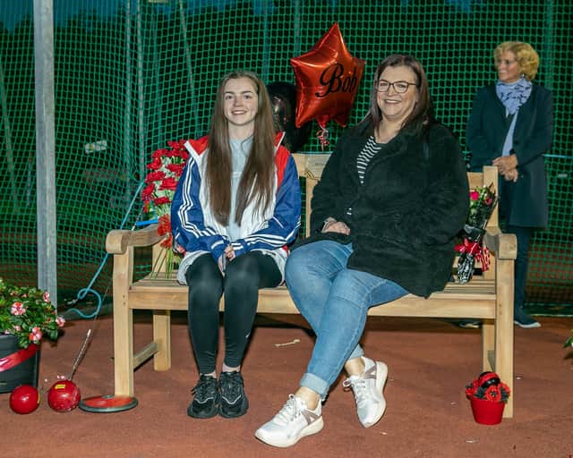 Lucy and Vici sitting on Bob's bench