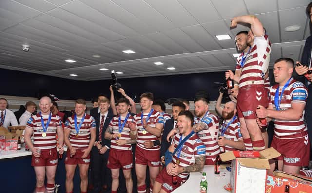 Wigan celebrate in the changing rooms