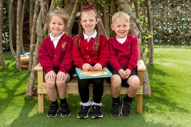 Pupils on the new bench at St William’s Catholic Primary School in Ince