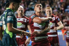 Wigan Warriors hooker Brad O'Neill celebrates scoring a try