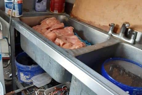 Raw chicken in the sink at The Rice Bowl