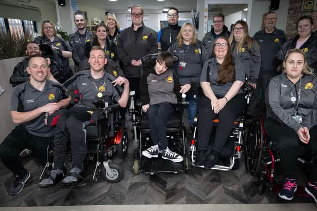 Members of the Happy Smiles Training team smiling whilat gathered together in a group