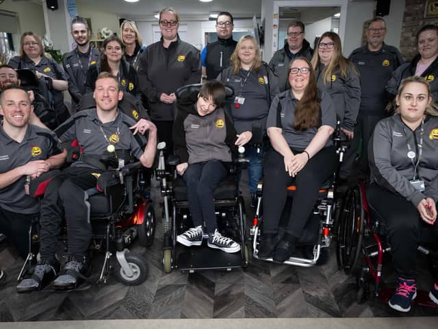 Members of the Happy Smiles Training team smiling whilat gathered together in a group