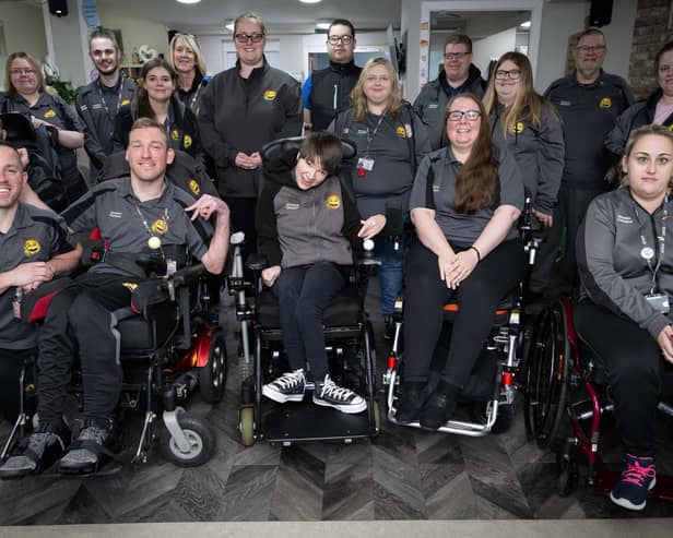 Members of the Happy Smiles Training team smiling whilat gathered together in a group