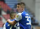 Charlie Hughes congratulates Ashley Fletcher for his goal against Birmingham