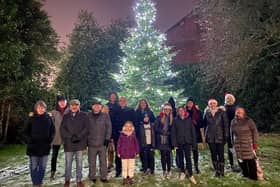 People came together at the Christmas tree on Wigan Lane, Swinley