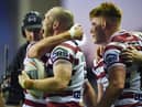 Liam Marshall scored a hat-trick as Wigan Warriors beat Warrington Wolves