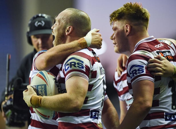 Liam Marshall scored a hat-trick as Wigan Warriors beat Warrington Wolves