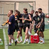 The Latics players grab a drink during their warm-weather camp in Dubai