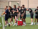 The Latics players grab a drink during their warm-weather camp in Dubai