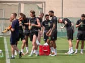The Latics players grab a drink during their warm-weather camp in Dubai
