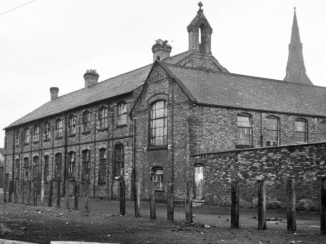 St. Joseph's RC School located between Caroline Street and Hodson Street just before it closed down on Wednesday 22nd of December 1971. The school was erected in 1874 and after closure pupils were relocated to St. Jude's in Worsley Mesnes. To the right is the spire of St.Thomas's Church also on Caroline Street.