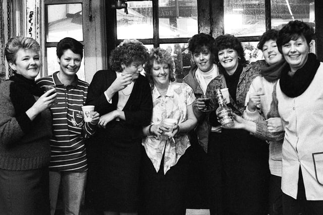 Market hall workers share a farewell drink on the last day of trading at the old Wigan Market Hall.