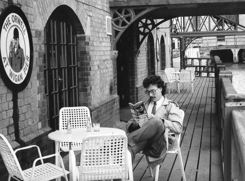 1984 and all that....The Orwell pub and restaurant at the Wigan Pier complex with journalist Paul Jones reading the great man's work The Road to Wigan Pier