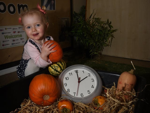 Lacey Atherton, one, promotes the time change at Brooklands Childcare, Wigan Road, Bryn, in 2019