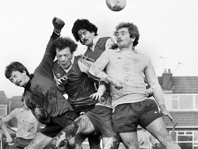 Gary Dickens takes on two defenders and the goalkeeper for the Post and Chronicle Sunday League against Oldham Sunday League in the Lancashire Inter League Tourney quarter-final at Ashton Town's ground on Sunday 21st of December 1980. The Post League won in a competition record win 11-2.
