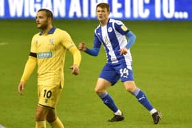 Luke Robinson in action for Latics