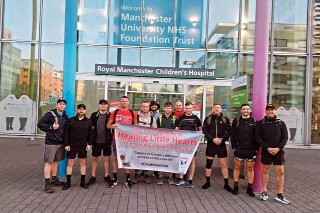 The 12-strong band of family and friends before they embarked on their epic trek from Royal Manchester Children's Hospital
