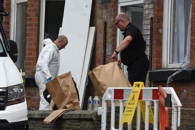 Police officers collect evidence