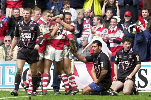Steve Renouf is congratulated by team-mates after one of his two tries during Wigan Warriors Good Friday Super League clash against St. Helens at the JJB Stadium on 13th April 2001. The match was a 22-22 draw.