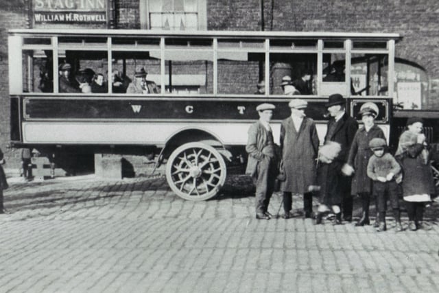 Wigan's first motorbus outside the Stag Inn at Orrell Post in 1919. This service ran between Orrell and Billinge. 
Picture courtesy of Trevor Peacock.