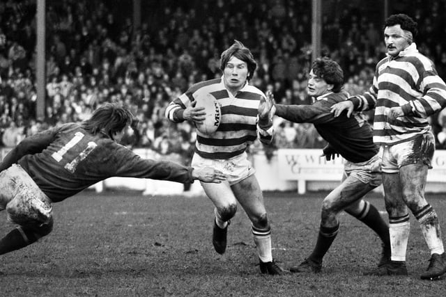 Wigan stand-off Martin Foy looks for a gap against St. Helens watched by Brian Case in the Good Friday league clash at Central Park on 1st of April 1983 which Wigan won 13-6.
Attempting to lay a hand on Foy from the right is future Wigan star forward Andy Platt.