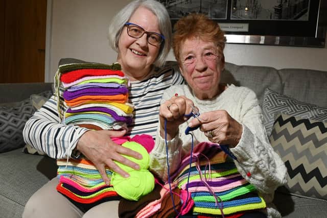 Barbara Mallon from Standish is knitting squares to make a giant blanket, to raise funds for Claire House Children's Hospice, pictured with friend from Standish Library Knit and Natter group Pat Mayren, left, who is helping with the charity challenge.