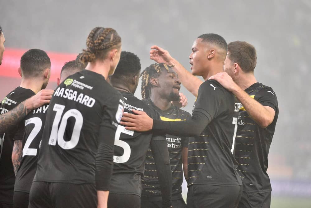 The Latics players celebrate Baba Adeeko's winning goal at Rotherham