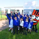 Staff and pupils at Britannia Bridge Primary School, Ince, were joined by Daniel O'Connell, right, and Strider, the mascot for Living Streets - WOW walk to school project, as they launched a new Park and Stride scheme at the school to ease congestion outside the school and promote healthy living.