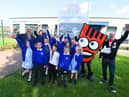 Staff and pupils at Britannia Bridge Primary School, Ince, were joined by Daniel O'Connell, right, and Strider, the mascot for Living Streets - WOW walk to school project, as they launched a new Park and Stride scheme at the school to ease congestion outside the school and promote healthy living.