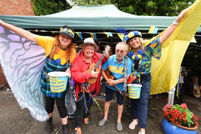 WIGAN - 23-07-22  from left, Jayne Marsh, Maggie Dainty, Gary Smith and Polly Pilkington MBE   A variety of musicians and ukulele groups took part in the Ukraineulele, a ten-hour marathon to raise funds for the Ukraine charity appeal, held at Coffee Etc, Parbold.