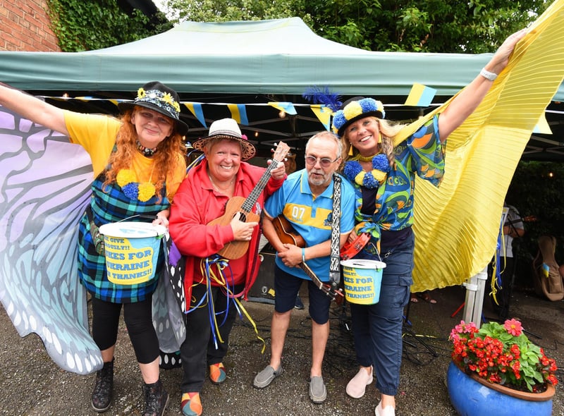 WIGAN - 23-07-22 from left, Jayne Marsh, Maggie Dainty, Gary Smith and Polly Pilkington MBE A variety of musicians and ukulele groups took part in the Ukraineulele, a ten-hour marathon to raise funds for the Ukraine charity appeal, held at Coffee Etc, Parbold.