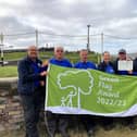 Photos show Canal & River Trust volunteer leader Neil Holladay (second right) with enthusiastic volunteers from the Leeds & Liverpool Canal - delighted to be awarded a coveted Green Flag and heritage award for a new 35-mile canal length from Liverpool to Wigan.