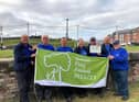 Photos show Canal & River Trust volunteer leader Neil Holladay (second right) with enthusiastic volunteers from the Leeds & Liverpool Canal - delighted to be awarded a coveted Green Flag and heritage award for a new 35-mile canal length from Liverpool to Wigan.